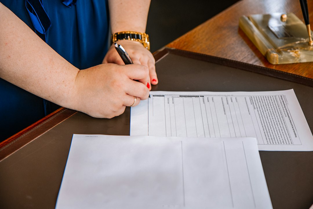 Person filling out a government form