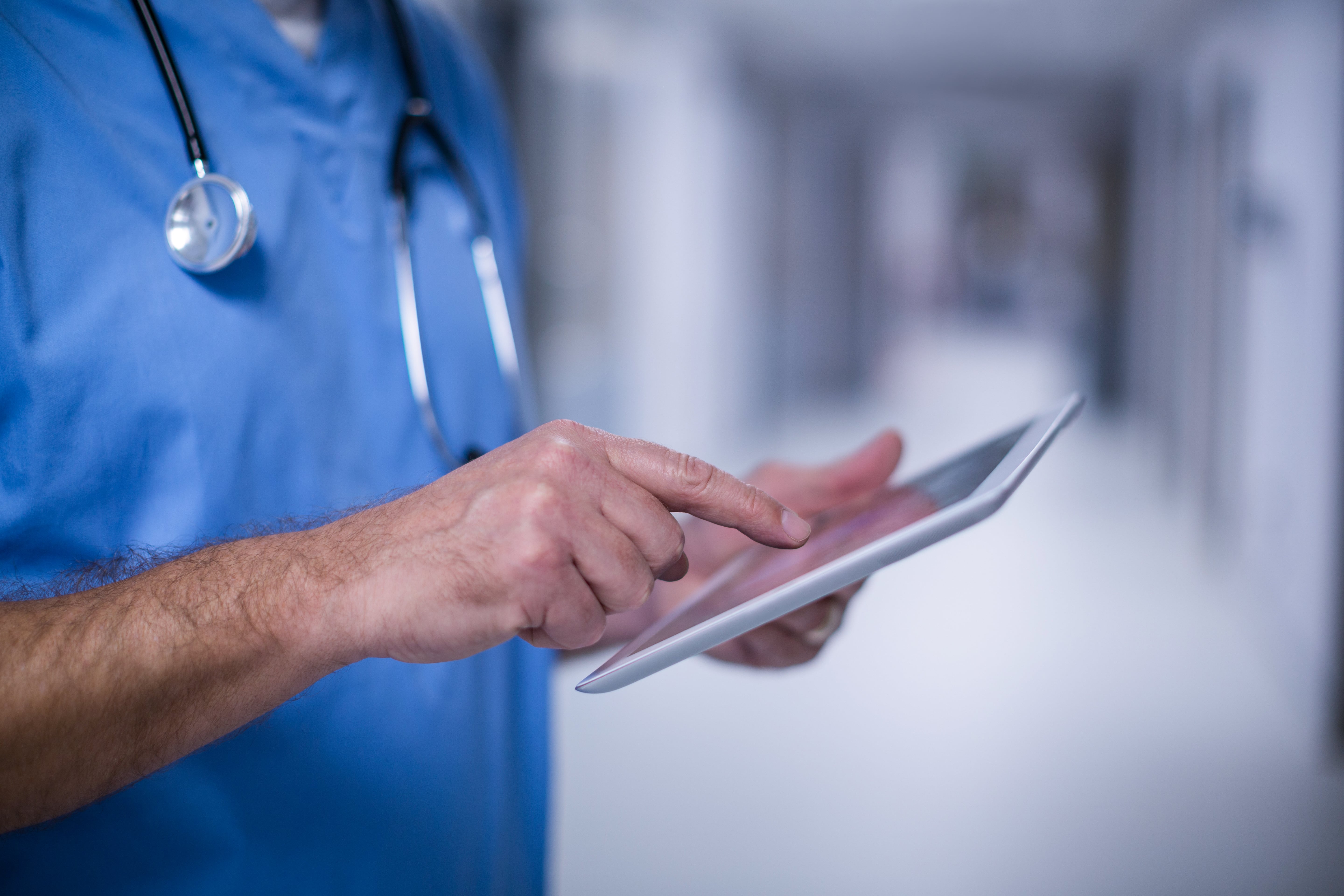 Doctor using a digital tablet