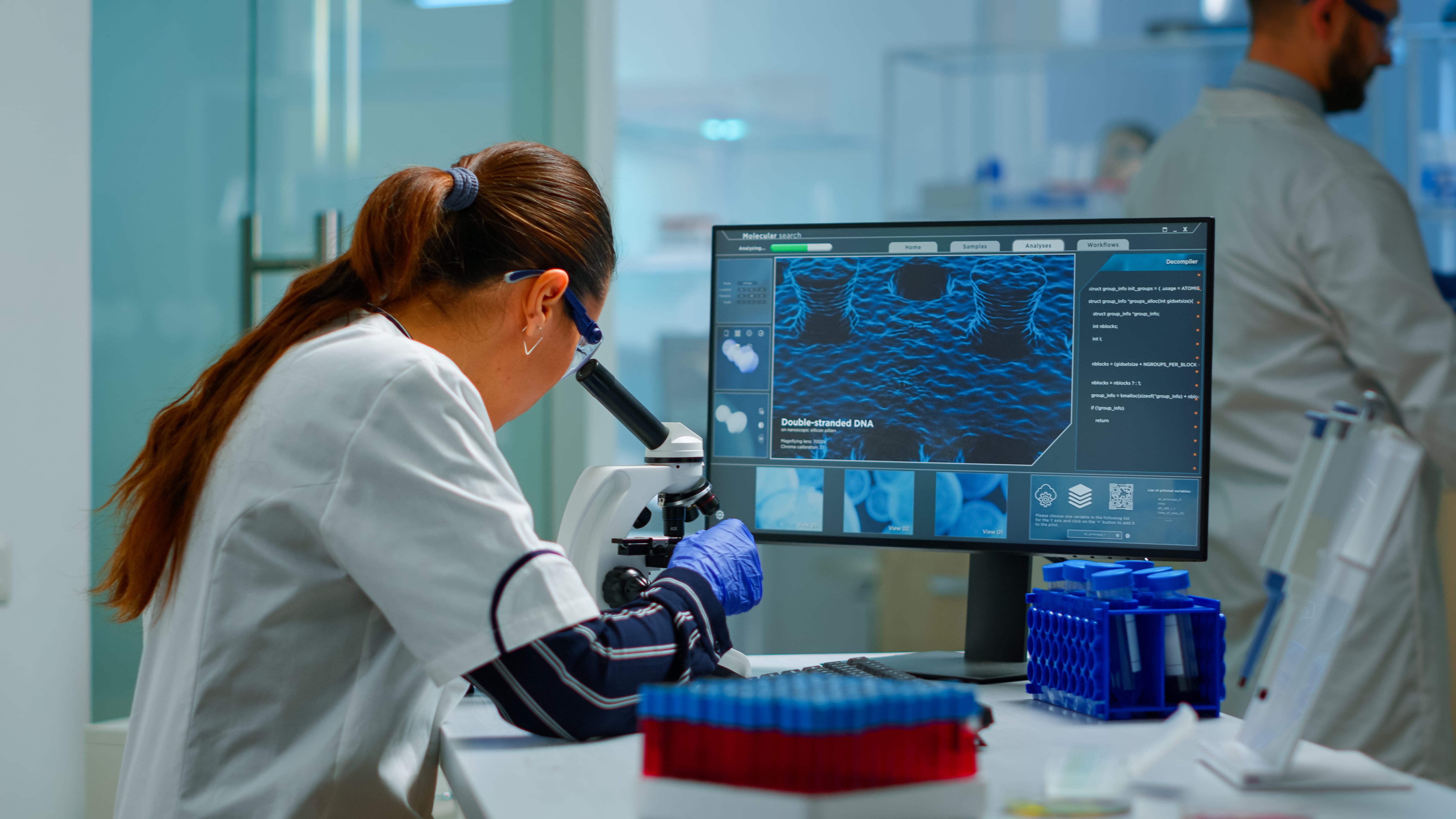 Lab researcher reviewing results on screen