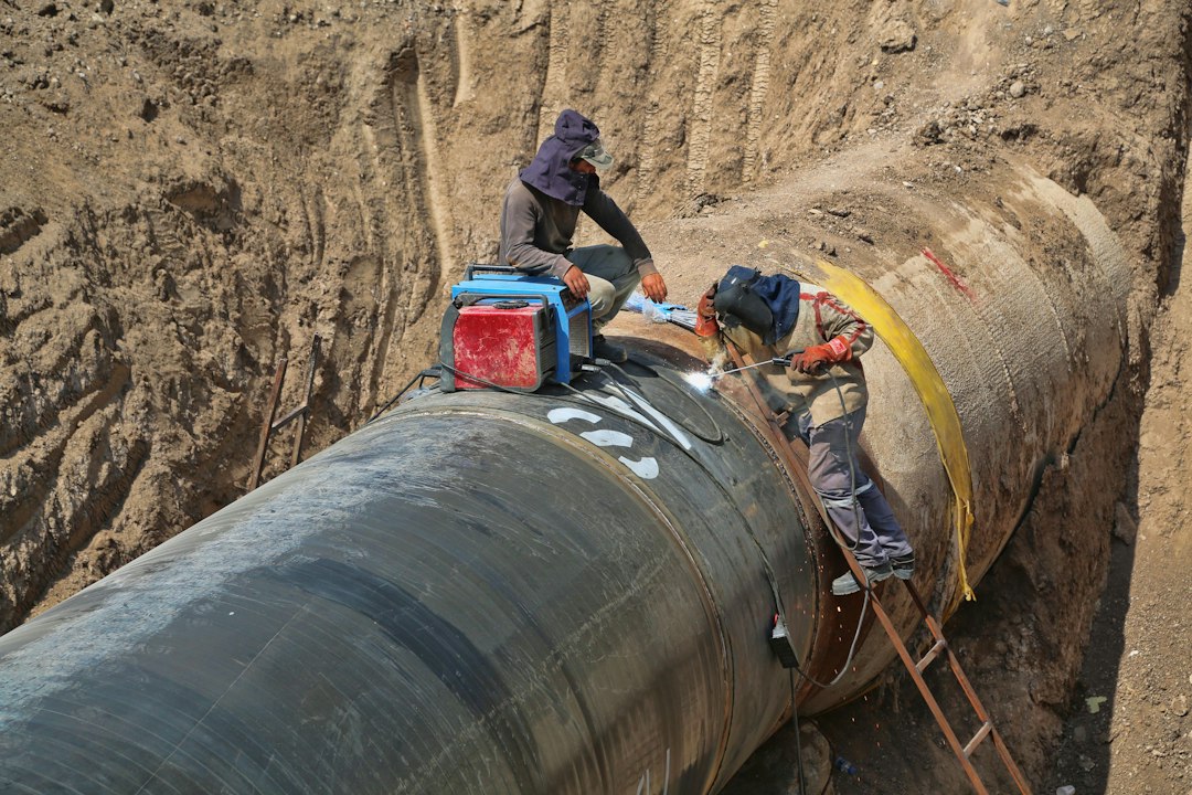 Workers inspecting a pipeline